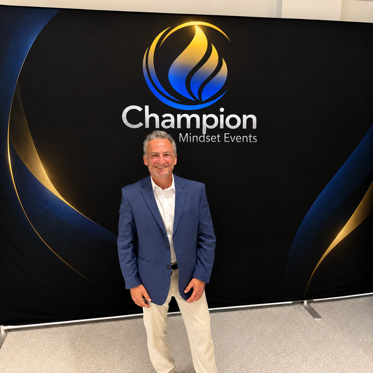Eric Stoller at a Champion Mindset Events step-and-repeat backdrop